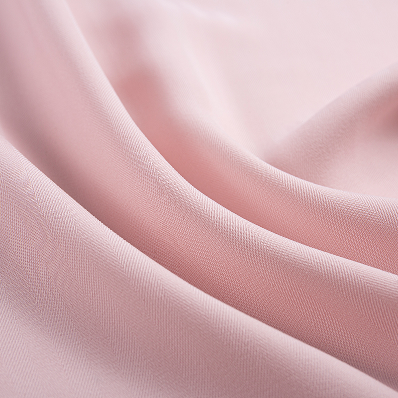 Tessuto twill elasticizzato a spina di pesce con trama