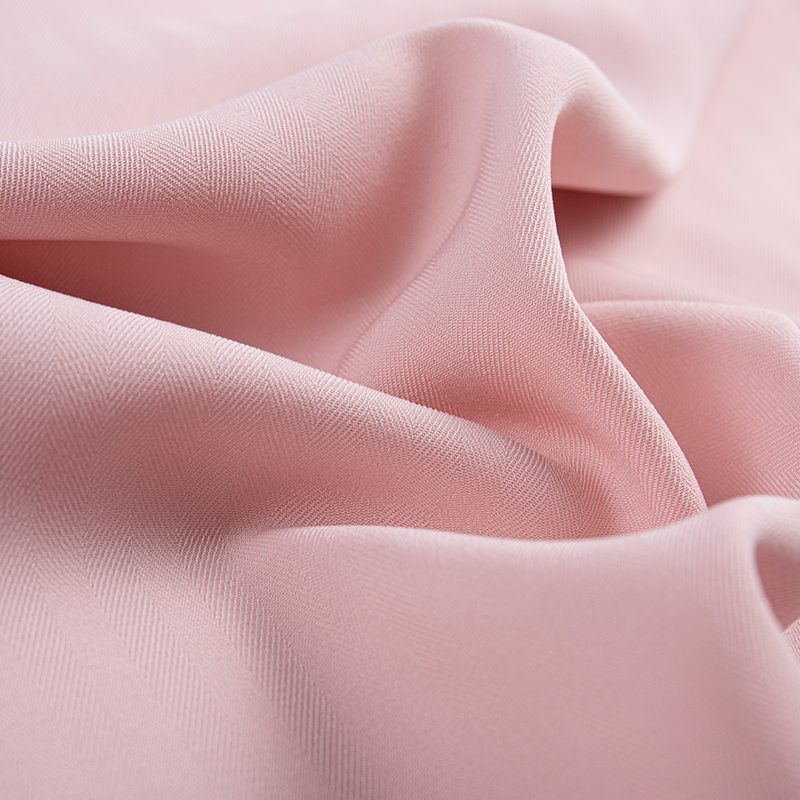 Tessuto twill elasticizzato a spina di pesce con trama