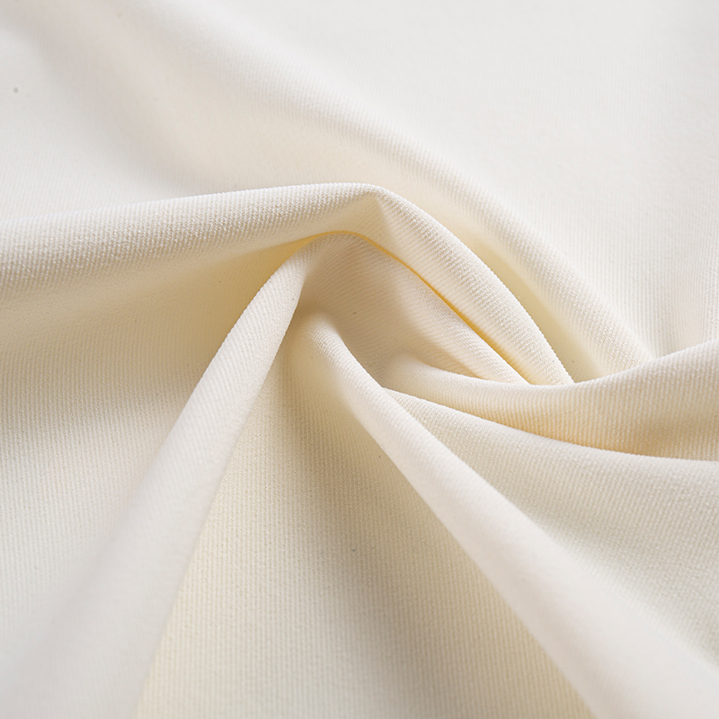 Tessuto elastico simile al cotone a filamento composito