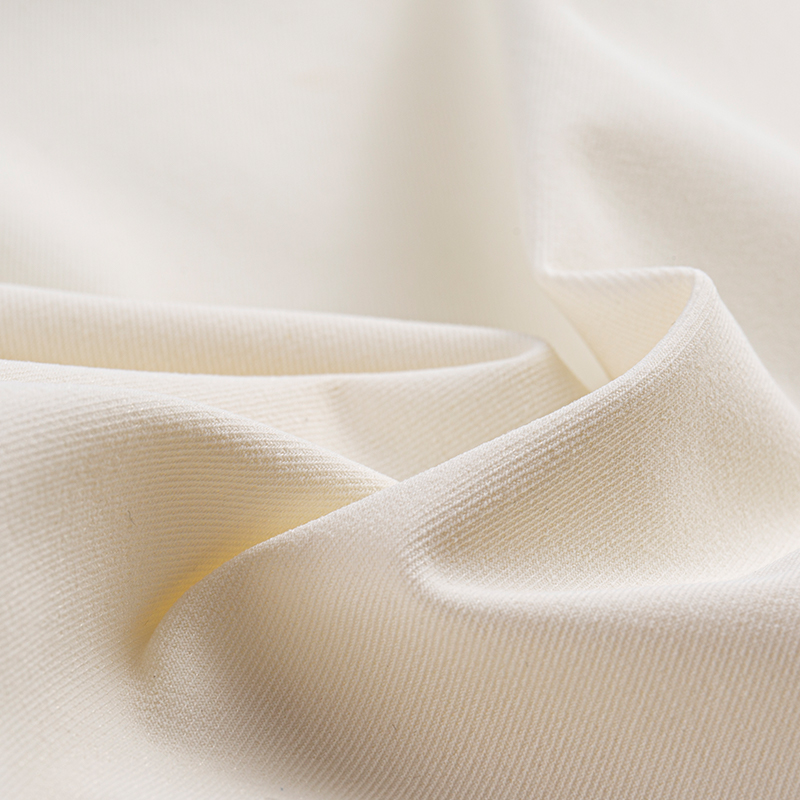 Tessuto elastico simile al cotone a filamento composito